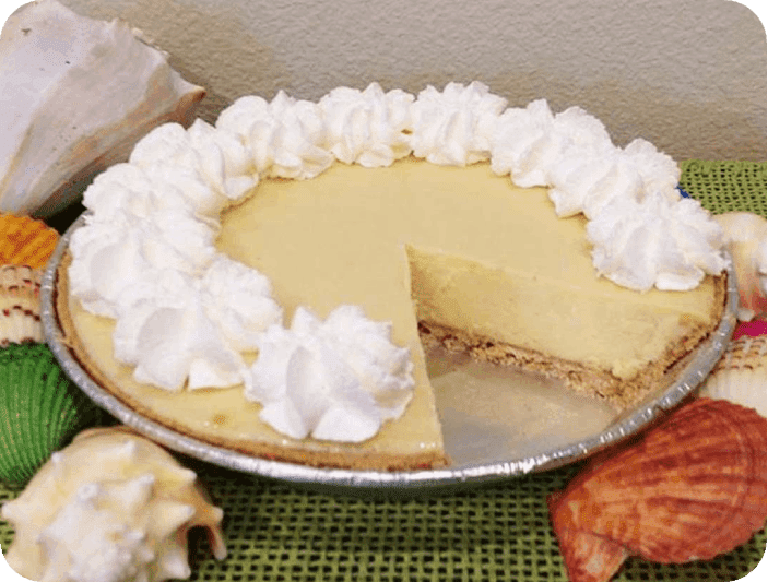 A pie with whipped cream on top of it.