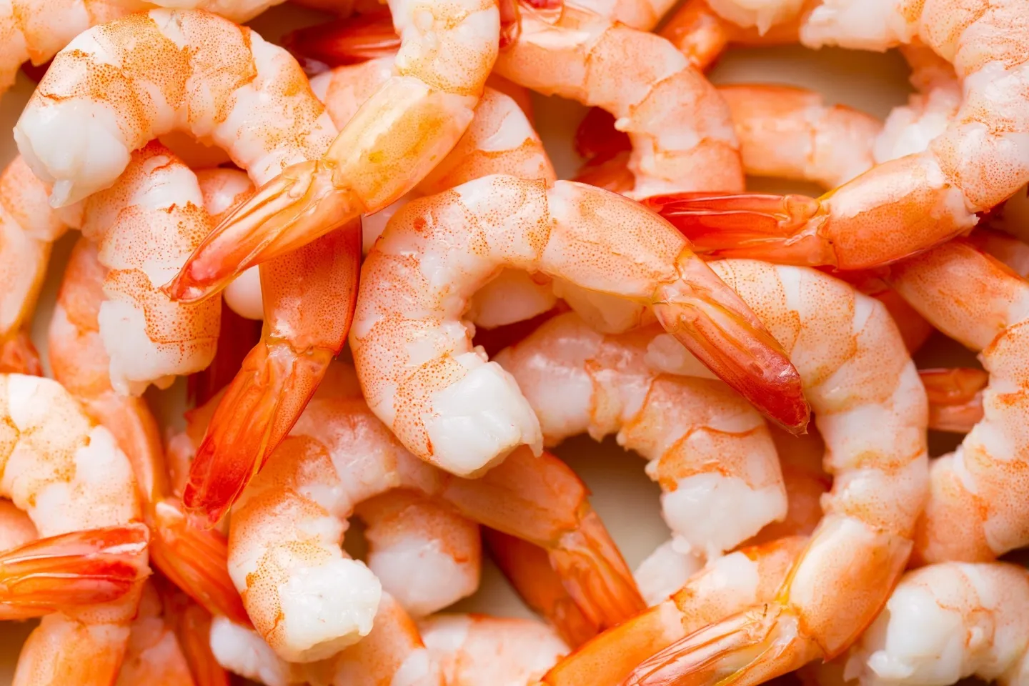 A close up of shrimp in the middle of a pile
